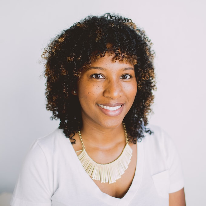 Dondrea Owens, African American woman with curly hair and a gold necklace