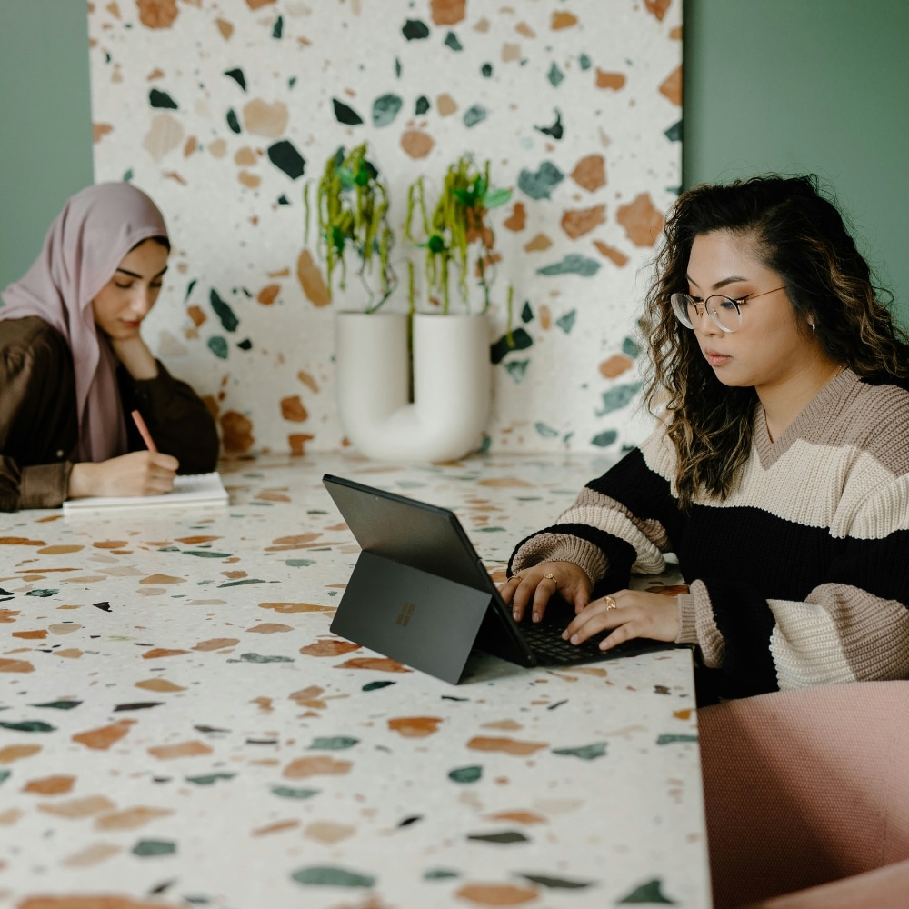 Two women working at a table